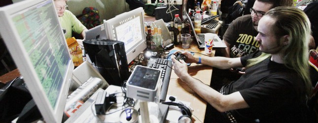 Computer programmers take part in a mass