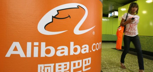 A pedestrian walks past Alibaba.com adve